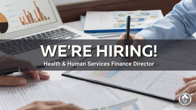 Close-up of hands analyzing financial charts and graphs on paper and a laptop, with text announcing a hiring opportunity for Health & Human Services Finance Director.