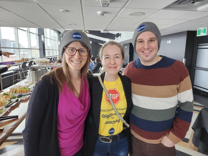 Three WLUFA Members, from the Music Faculty, smiling for a photo.