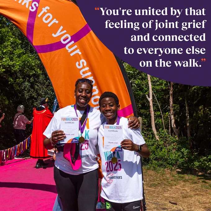 A vibrant, sunny image of mother and son, Sharon and Fabian, by an orange St Christopher's banner at Fun Walk 2025. Quote reads: "You're united by that feeling of joint grief and connected to everyone else on the walk."