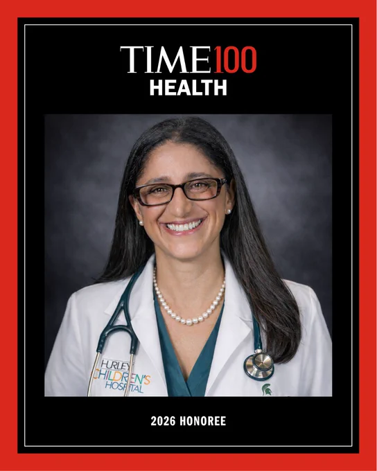 Portrait of Dr. Mona Hanna smiling in a white coat with a stethoscope and pearl necklace, framed in a TIME100 Health graphic with a red border. Text reads “TIME100 Health” at the top and “2026 Honoree” at the bottom.