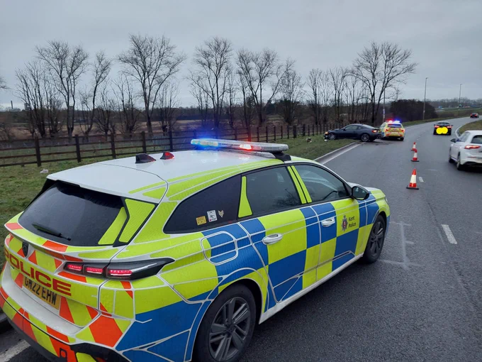 Police car, crashed car and damaged lamp post
