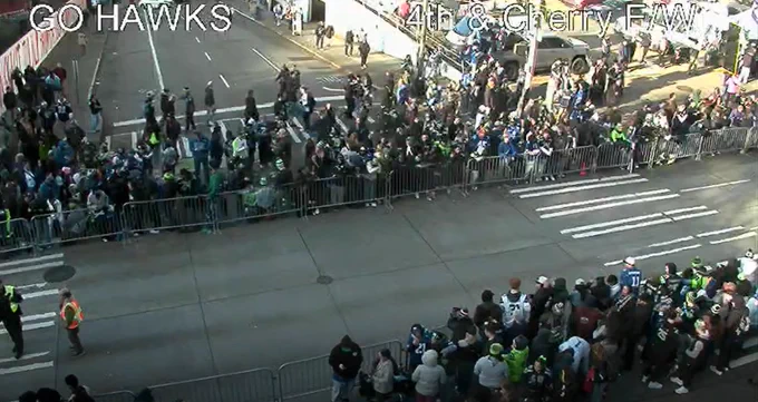 People crowding along the sidewalk at 4th and Cherry
