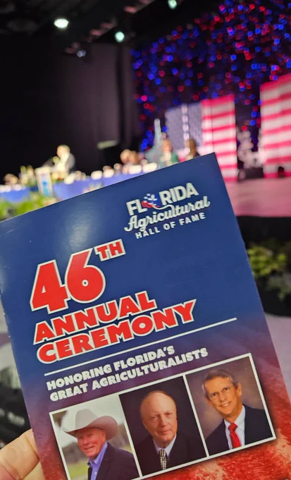 Program for the 46th annual ceremony for the Florida Agricultural Hall of Fame held up in front of the stage.