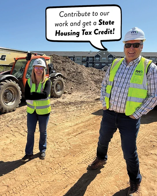 Two people wearing hard hats and safety vests stand at a construction site. A speech bubble from one worker's mouth reads, "Contribute to our work and get a State Housing Tax Credit!"