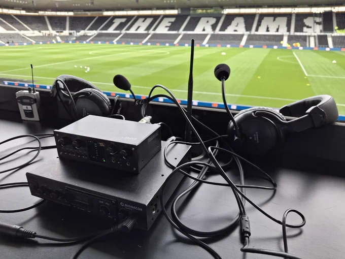 Landscape photo of the AMS commentary equipment with the Pride Park pitch and the East Stand nicely reading ‘The Rams’ in the background