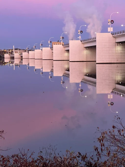 Pink and blue sky looking over the River towards the bridge 