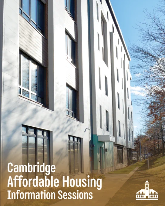 Image of a white housing building with large windows. 