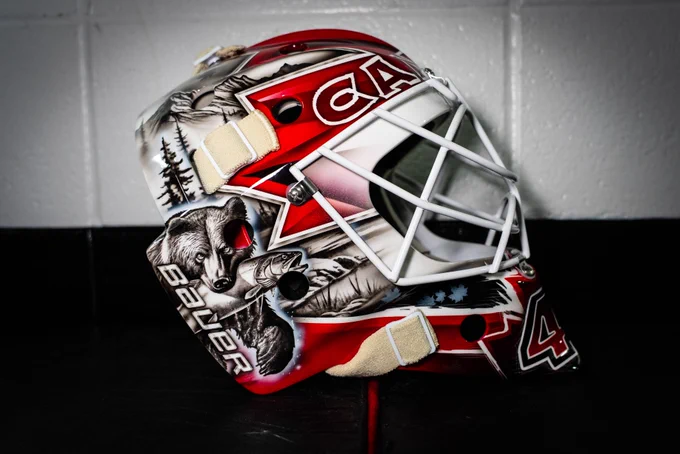 The side of LT's mask shows a bear with a fish in its mouth.