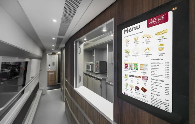 A photograph of the Cafe Bar on the Class 897 fleet, including the digital menu screen.