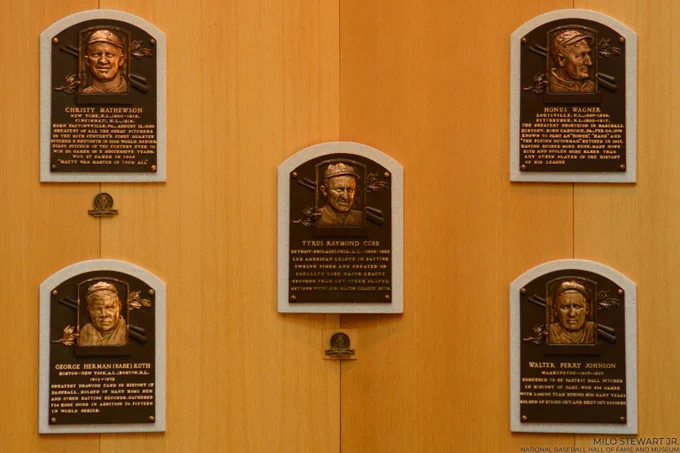 The Hall of Fame plaques of Ty Cobb, Babe Ruth, Honus Wagner, Christy Mathewson and Walter Johnson on the oak wall of the Plaque Gallery. (Milo Stewart Jr./National Baseball Hall of Fame and Museum)
