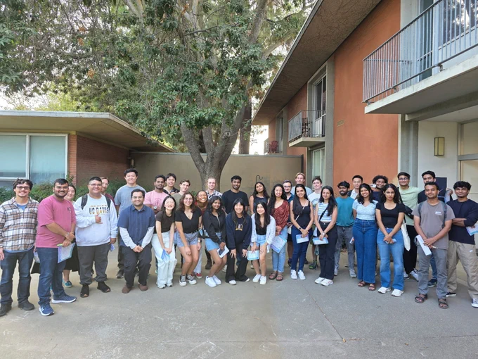 Large group of graduate students smiling.