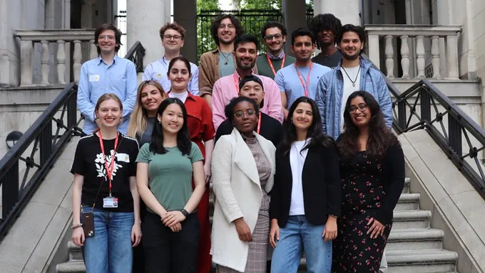 A group of King-up Accelerator attendees posing for a pic standing at the stairs at the Bush House Court Yard.