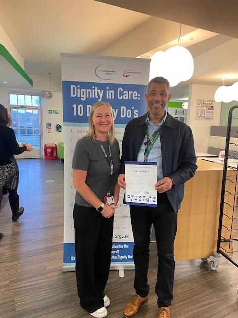 Joe and Tina with his certificate.