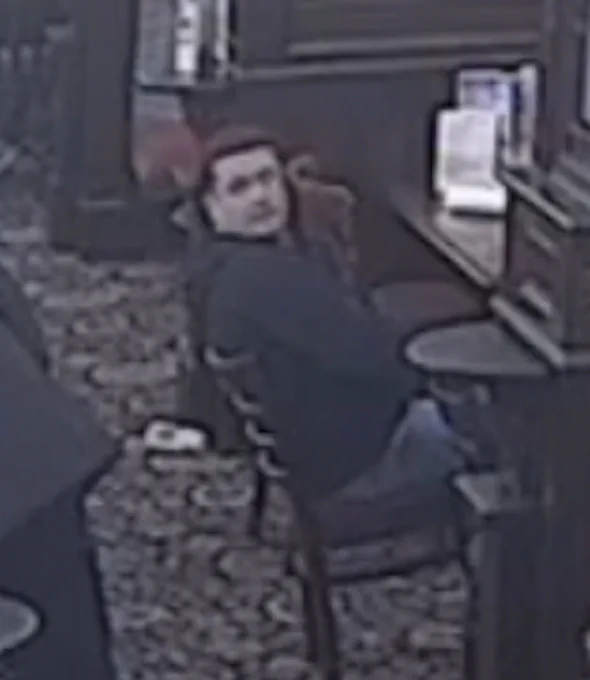 A CCTV image of a man
