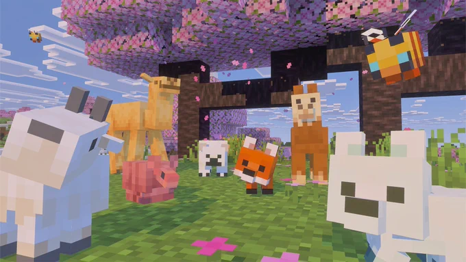 Image of all the new baby mob looks for our new B/P/S moment in Minecraft. A baby goat, armadillo, camel, polar bear, fox, llama and bee all stare curiously into the camera with a cherry blossom tree in the background.