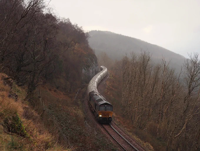 A work stained 66304, just changed over from 66737, on today’s 6s45 Alcan descending Glen Douglas bank to Arrochar in between sleet showers.