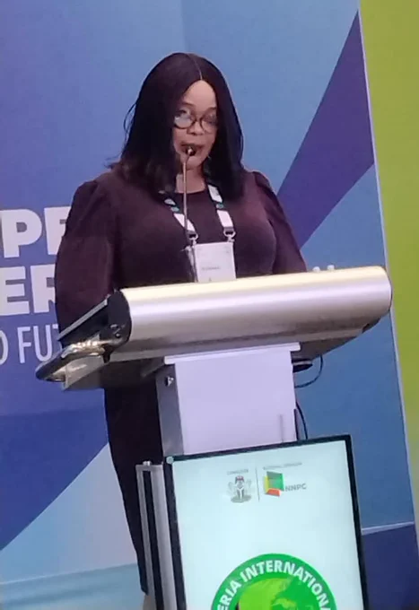 The representative of the Permanent Secretary MPR. and Director of Midstream and Downstream Department, Ministry of Petroleum Resources, Mrs. Ikenma Irene delivering the welcome address at the 9th Nigeria International Energy Summit (NIES 2026) in Abuja.
