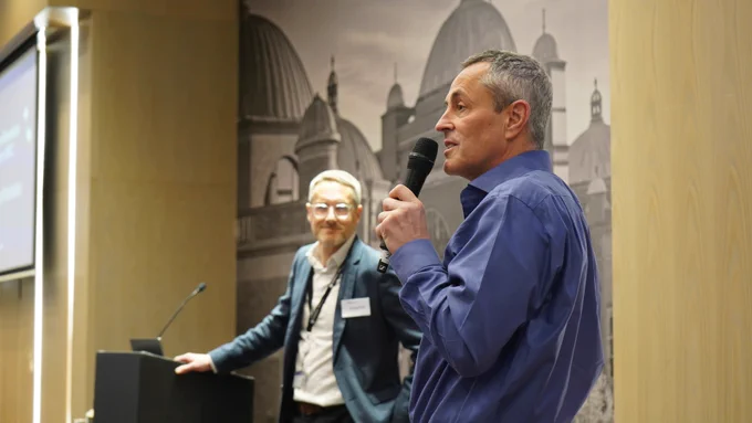 Prof Neil Hanley opening the event on stage with Prof Andrew Filer