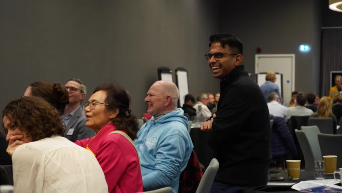 Table of attendees engaged in discussion