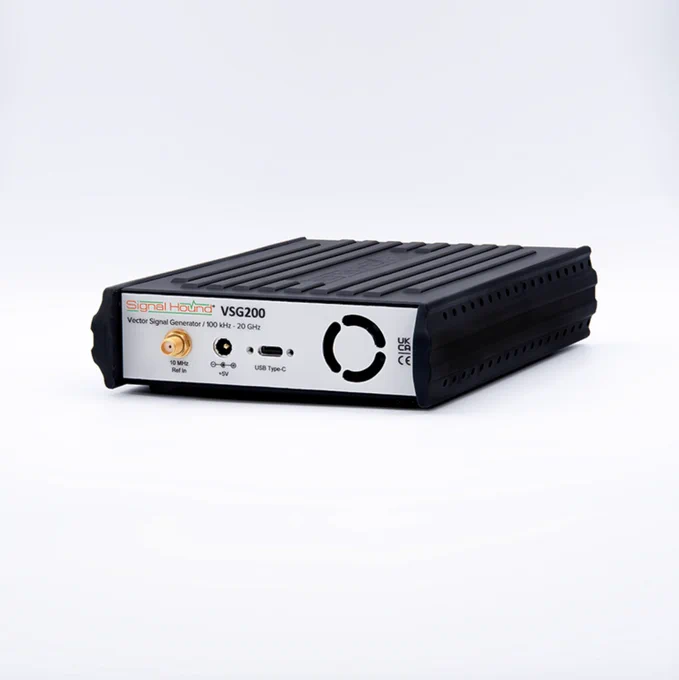 A Signal Hound VSG2000 vector signal generator. It features a ribbed, rectangular design with ports and logos on the front panel. The device is black with white labeling and includes USB connectivity.