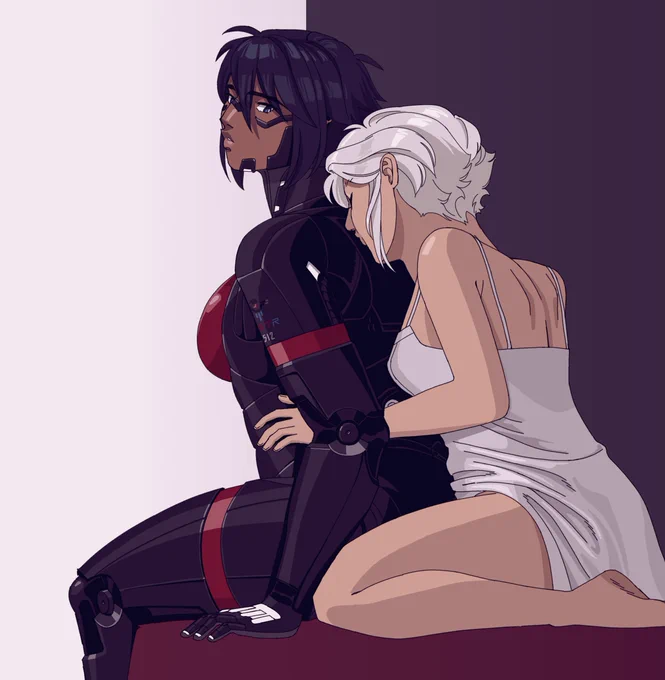 Ariane sitting behind Elster, kissing her on her back.