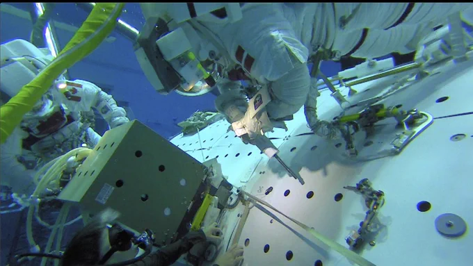 ESA astronaut Andreas Mogensen is seen in this image installing the Columbus Ka-band or ColKa terminal that will enable faster communication with Europe during a ‘dress rehearsal’ in the Neutral Buoyancy Lab at NASA’s Johnson Space Center in Houston, Texas in 2018. 