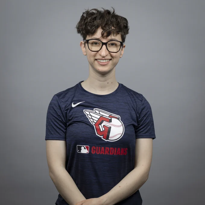 Ilana Mishkin poses for a headshot in a navy Guardians t shirt