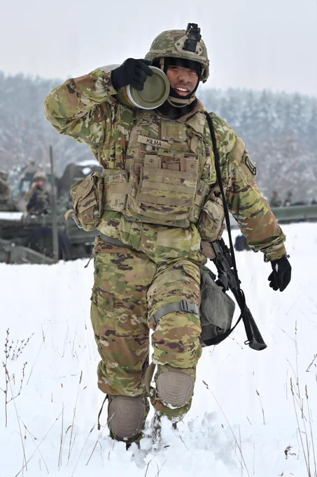 U.S. Paratroopers assigned to 4th Battalion, 319th Field Artillery Regiment, 173rd Airborne Brigade, prepare, load and fire an M777 Howitzer during Dynamic Front 26 at the Grafenwoehr Training Area, Grafenwoehr, Germany, Jan. 27, 2026. Dynamic Front is the practical application of the Eastern Flank Deterrence Line (EFDL) and enhances the U.S. and NATO's ability to coordinate lethal and non-lethal effects in a distributed battlefield. (U.S. Army photo by Pfc. Tomas J. Arce)