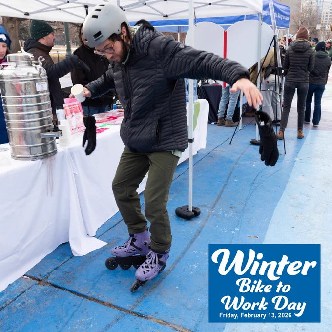 A person in purple rollerblades stops to get a coffee at a booth on Winter Bike to Work Day. The words Winter Bike to Work Day and Friday, February 13, 2026 appear on a blue square in the corner of the image.