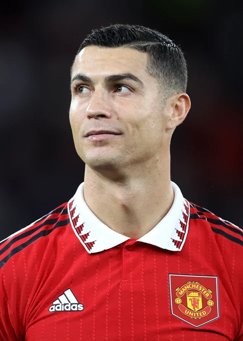 Cristiano Ronaldo wearing our 2022/23 red home jersey with adidas logo and club crest visible on the chest.