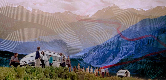Collage-style image of students and faculty gathered near white vans in a grassy field with a dramatic mountain range in the background. Overlaid with circular graphic patterns and a red winding path, symbolizing exploration and learning in the field.

