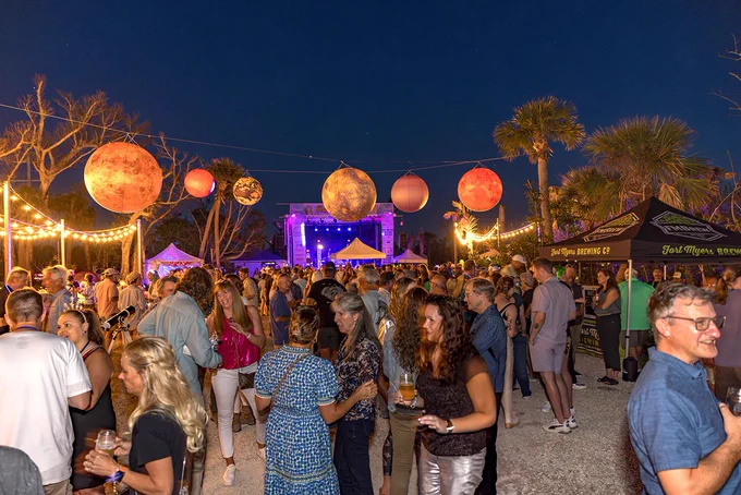 crowd and stage at night outdoors