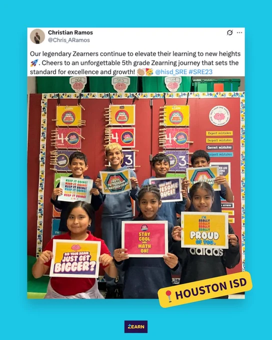 Group of students holding motivational signs in Chris Ramos' classroom, standing in front of a colorful backdrop that features resources from the Zearn Math Motivation Hub.