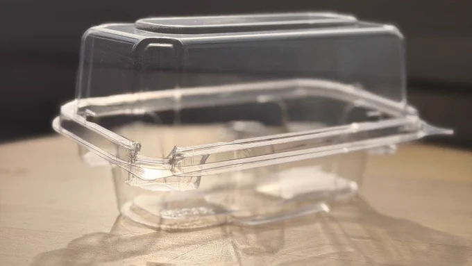 Crystal clear 2-pack compostable cupcake container made from plant-based PLA corn plastic, featuring a sleek design and secure snap closures.