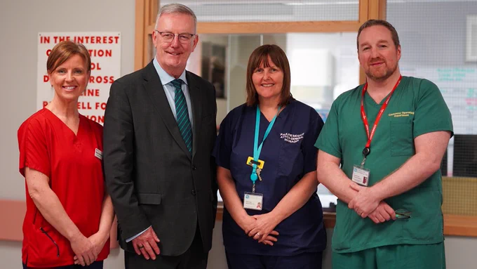 Hospital staff in their uniforms pictured with Health Minister Mike Nesbitt.