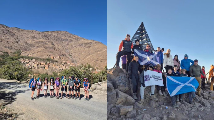 A group of people are hiking along a dirt road with a mountainous backdrop. In a separate image, a group is gathered at the top of a mountain near a small pyramid-shaped monument. Some are holding flags and a sign saying "Outlook Expeditions." The sky is clear and blue.