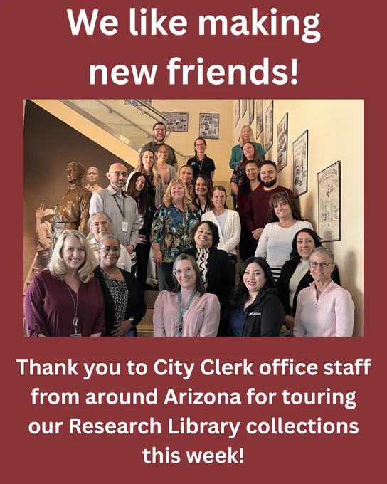 A group photo of people standing on the stairs and smiling in the lobby of the Polly Rosenbaum State Archives and History Building. The caption says "We like making new friends! Thank you to City Clerk office staff from around Arizona for touring our Research Library collections this week!"