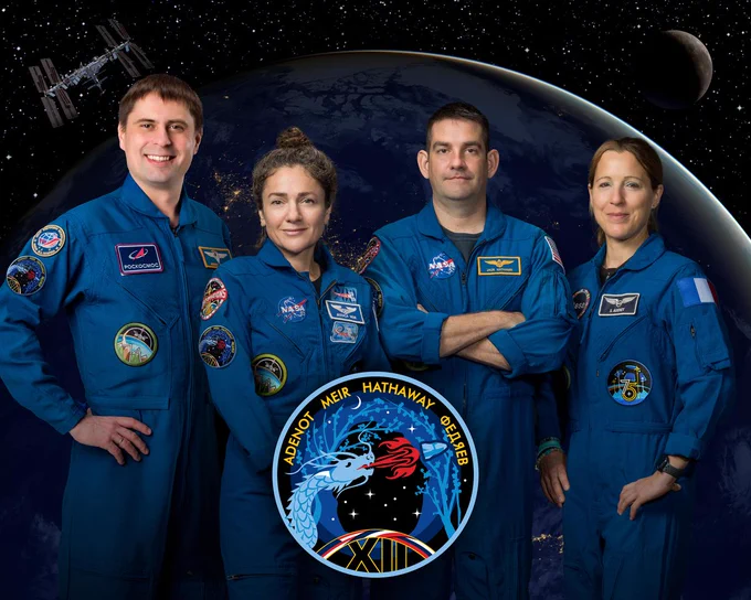 The four members of NASA's SpaceX Crew-12 mission to the International Space Station pose together for an official crew portrait. From left are Andrey Fedyaev of Roscosmos, NASA astronauts Jessica Meir and Jack Hathaway, and ESA (European Space Agency) astronaut Sophie Adenot. The four are wearing blue flight suits with space agency and mission patches. The Crew-12 mission patch which shows a dragon, the spacecraft, a starry background and the crew's names is seen in the lower center. Credit: NASA