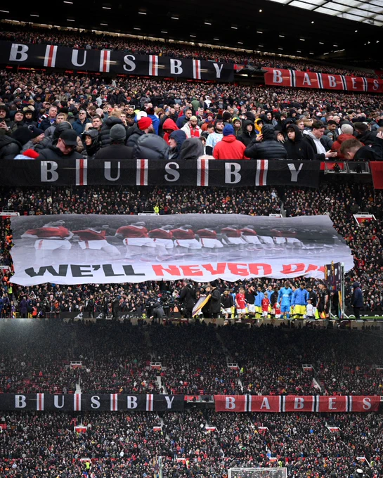 United’s tribute in the Stretford End for the Flowers of Manchester.