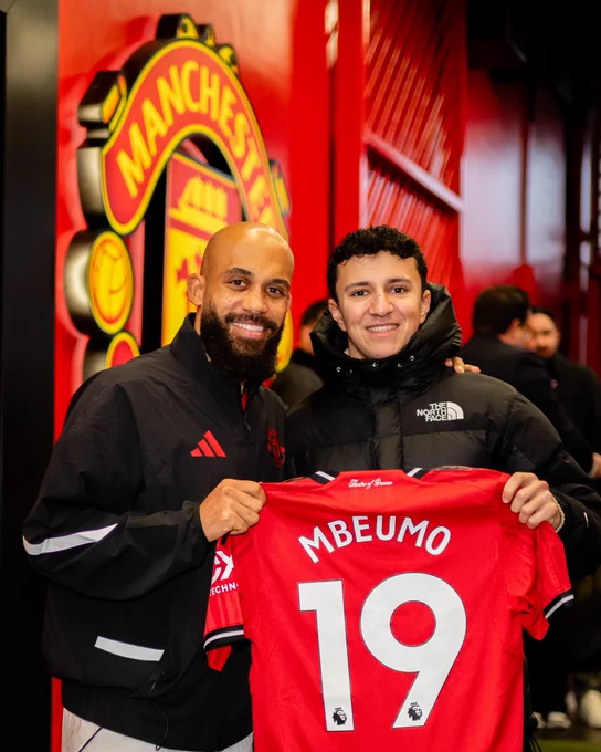 Bryan Mbeumo and Isack Hadjar pose for a post-match photo with an Mbeumo #19 home shirt.