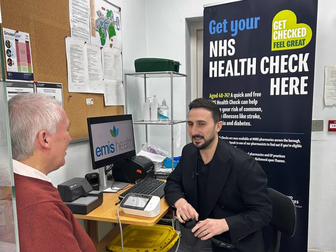 Cllr Piers Allen undergoing an NHS Health Check with a local Pharmacist