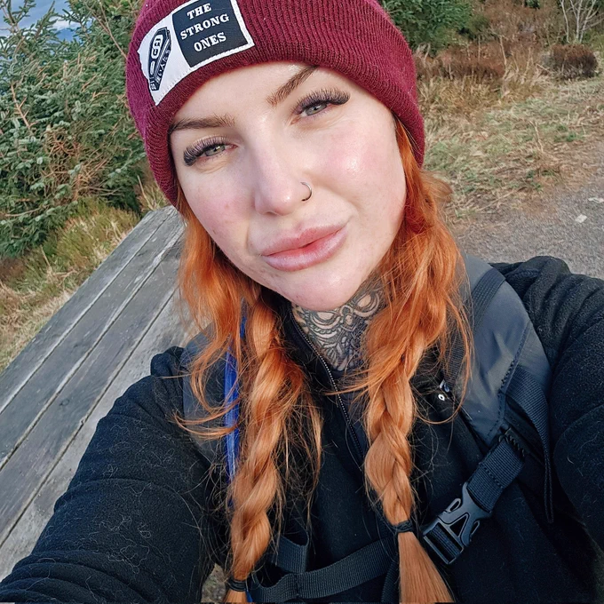 Kirsti outside with a beanie on and hiking gear