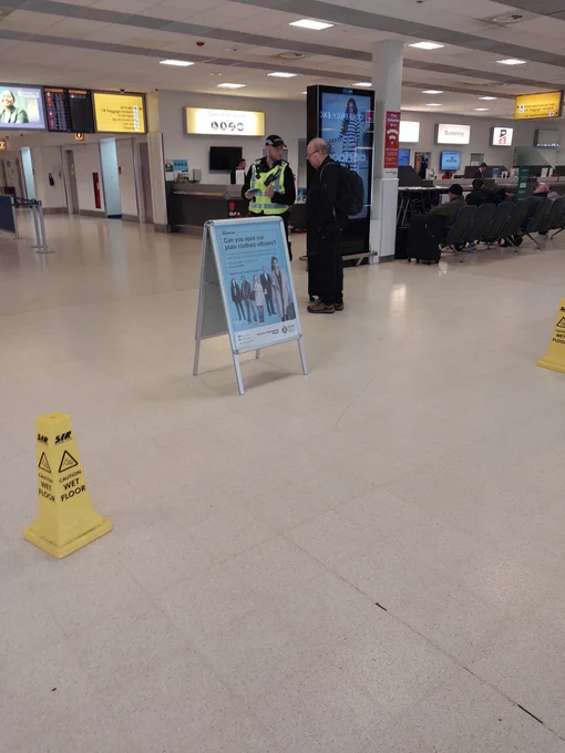 Officer engaging with the public, highlighting the Servator message