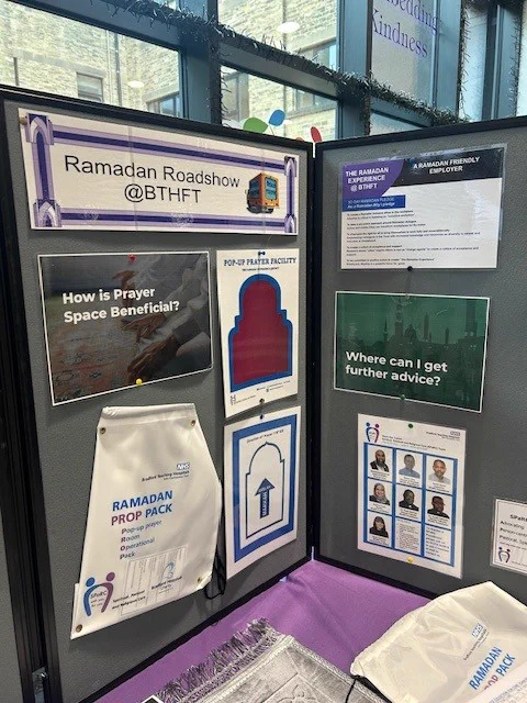 Board with posters on it advertising support available to colleagues during Ramadan.