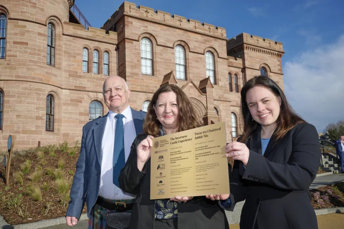 Left to right, Highland Council Convener Bill Lobban, Kirsty McNeill, UK Government Minister for Scotland, and Kate Forbes, Deputy First Minister of Scotland holding up a plaque outside of Inverness Castle.