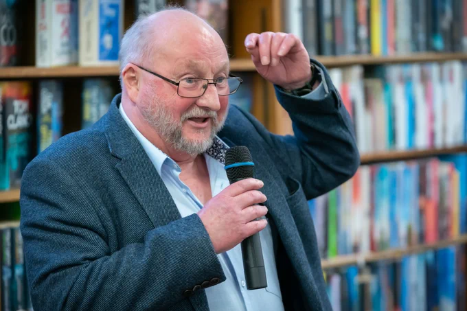 Man talking into a microphone 