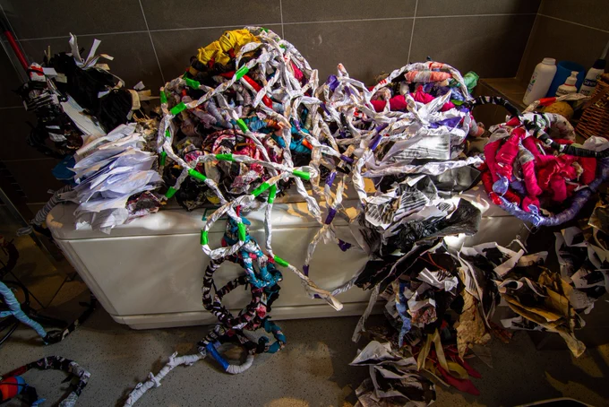 Twisted bound forms fill a bath and spill out in a mess of tangled forms teabags