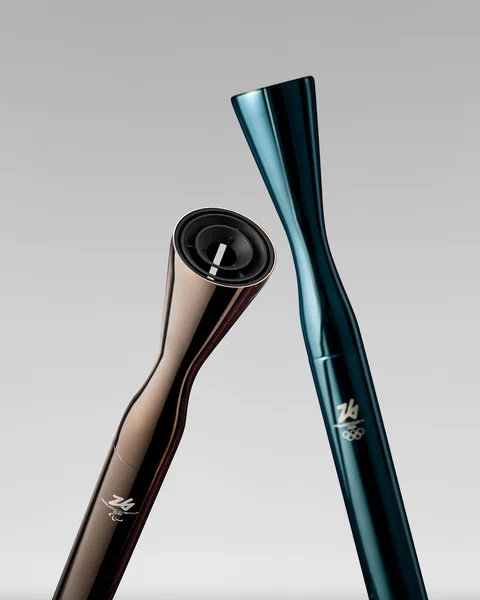 Two sleek metallic cylindrical torches, each with a flare at the end. One is gray and one is teal.