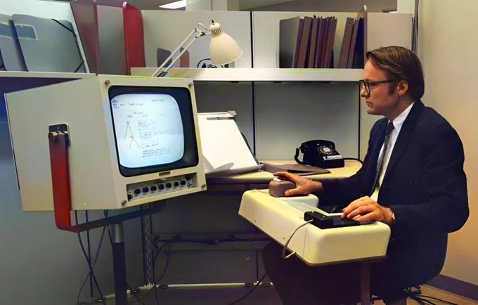 First Public Demonstration of the Computer Mouse and Graphical User Interface — 1968

On December 9, 1968, in what would later be called “The Mother of All Demos,” computer scientist Douglas Engelbart gave the world its first glimpse of modern computing. Held at the Fall Joint Computer Conference in San Francisco, Engelbart’s 90-minute live demonstration introduced revolutionary concepts that now define how we interact with computers.

Among the innovations unveiled were the **computer mouse**, a small wooden device with two perpendicular wheels, designed to navigate on-screen content. Engelbart also showcased **windowed computing**, **hypertext links**, **real-time text editing**, and the **graphical user interface** — decades before these features would appear in mainstream personal computers.

