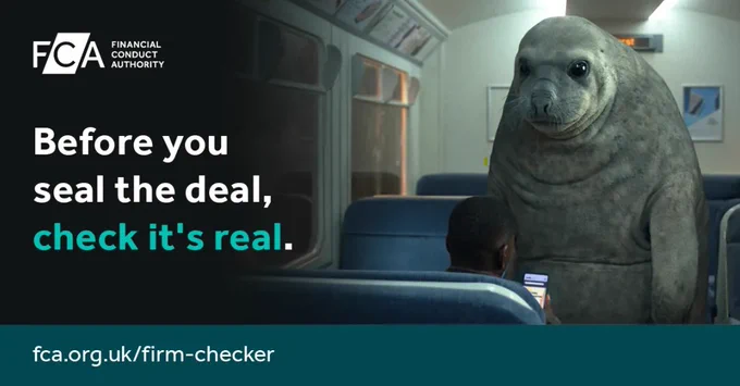 A person is sitting in a train seat, looking at a phone, while a large seal stands in the aisle, watching. Text on the image says, "Before you seal the deal, check it's real." The Financial Conduct Authority (FCA) logo is at the top left, and the website "fca.org.uk/firm-checker" is at the bottom.